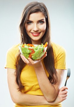 Woman Holding a Bowl of Salad